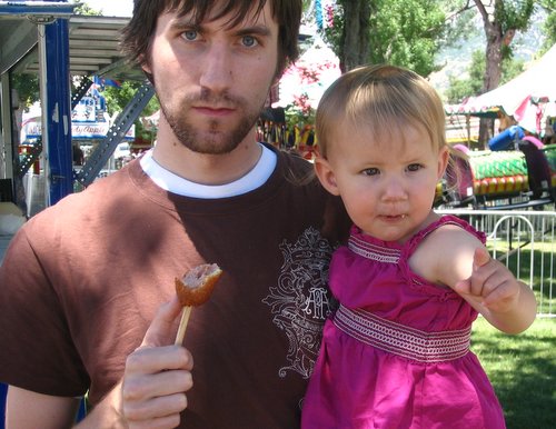 me and my baby eating a corndog